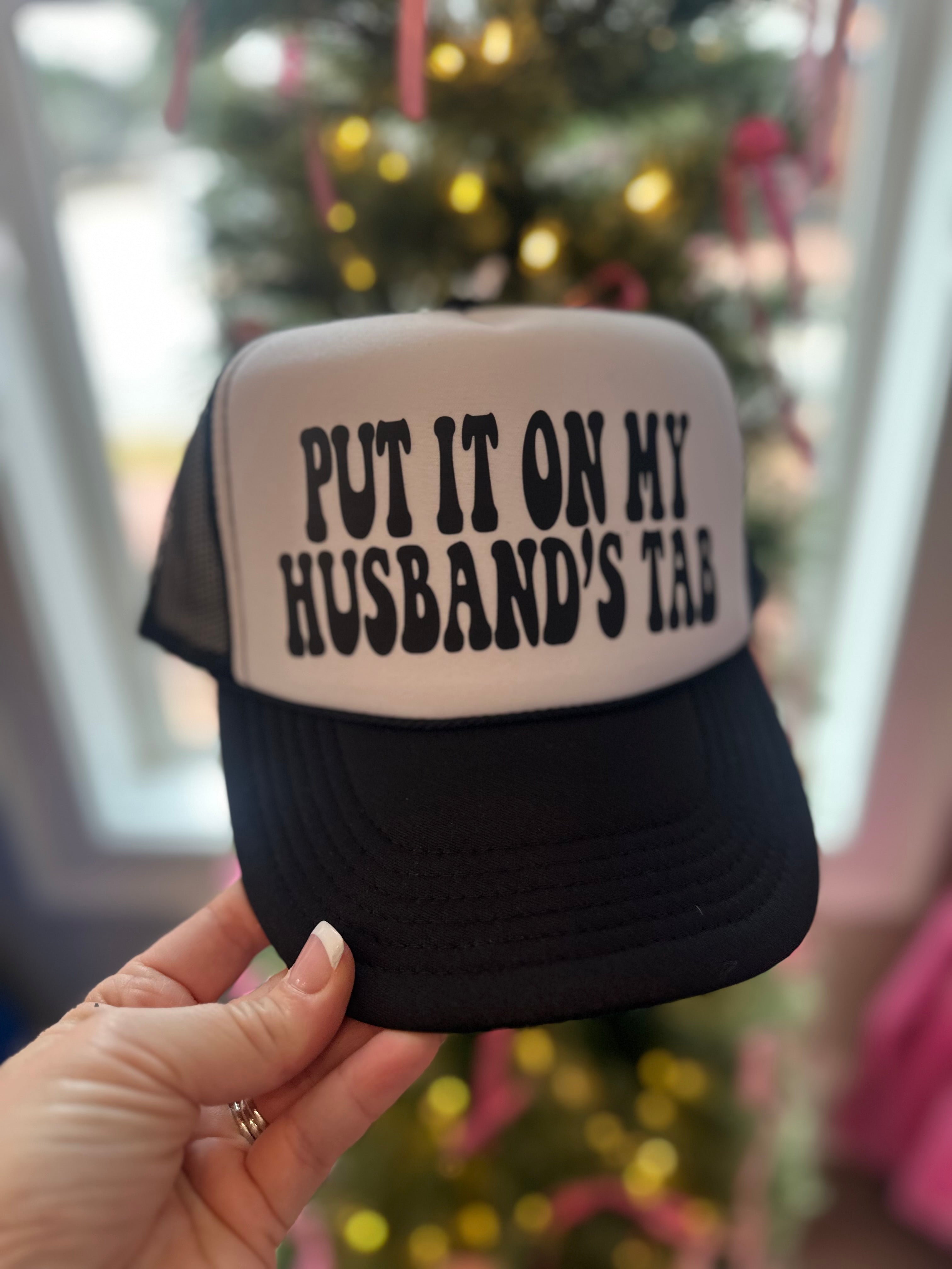 Put It On My Husband’s Tab Trucker Hat