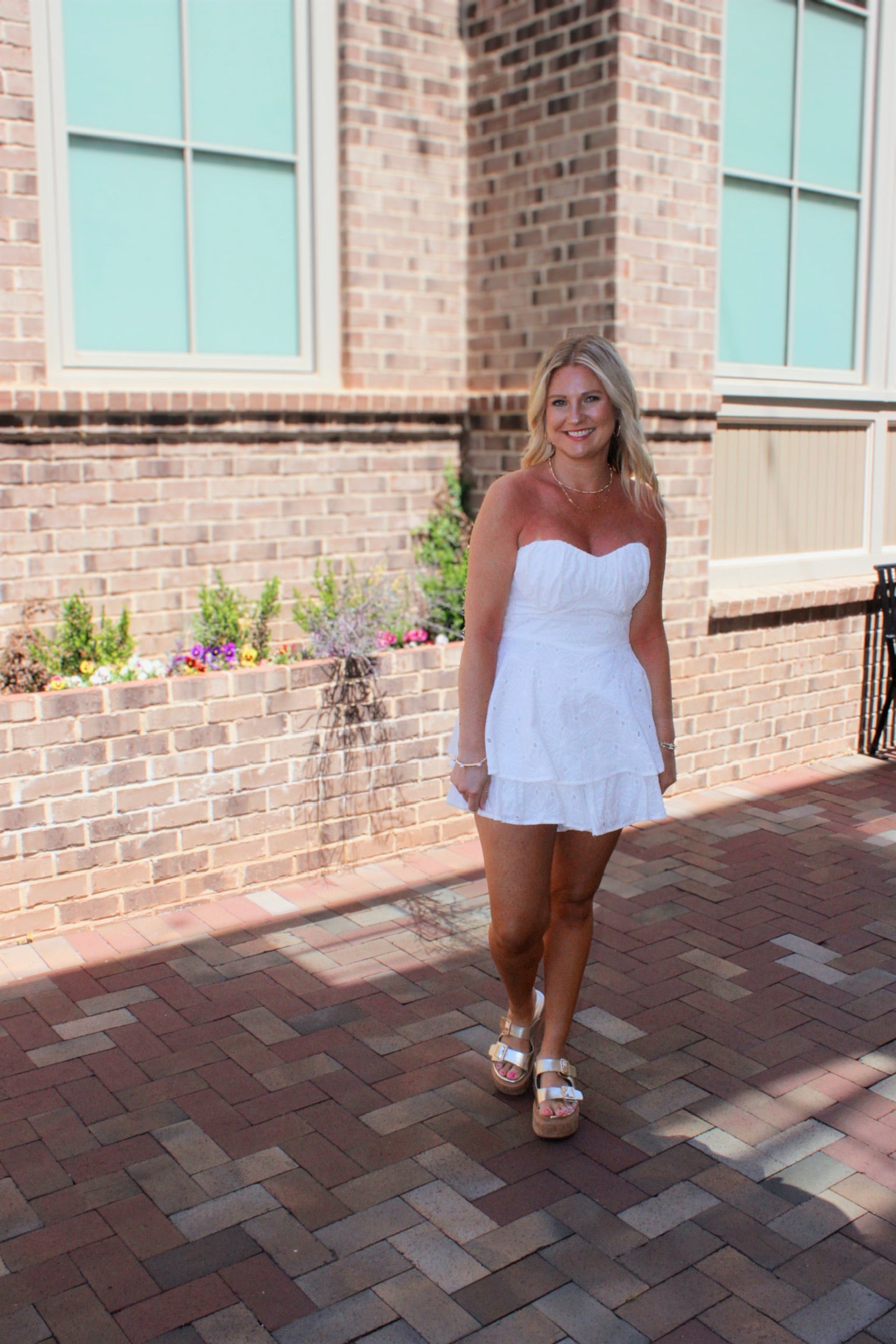 She Can and She Will Strapless Tiered Cotton Eyelet Romper in White